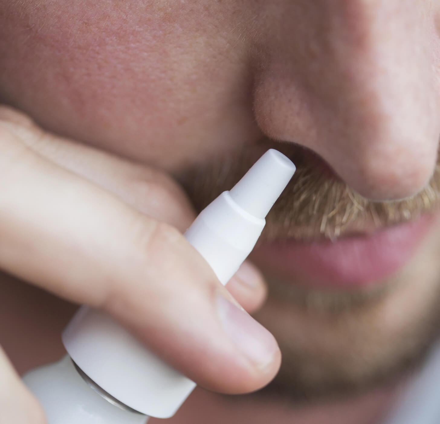 close-up-of-man-using-nasal-spray-2024-10-18-06-23-15-utc (1)