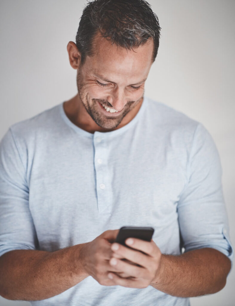 laughing-male-entrepreneur-standing-against-a-gray-2023-11-27-05-33-37-utc (1)