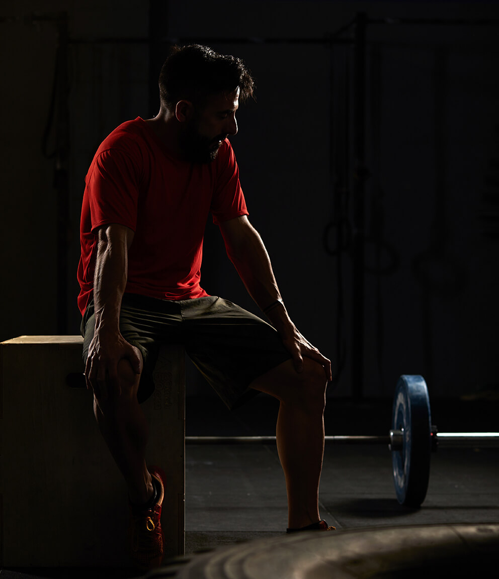 man-sitting-down-and-resting-in-a-gym-2024-10-14-04-00-55-utc (1)