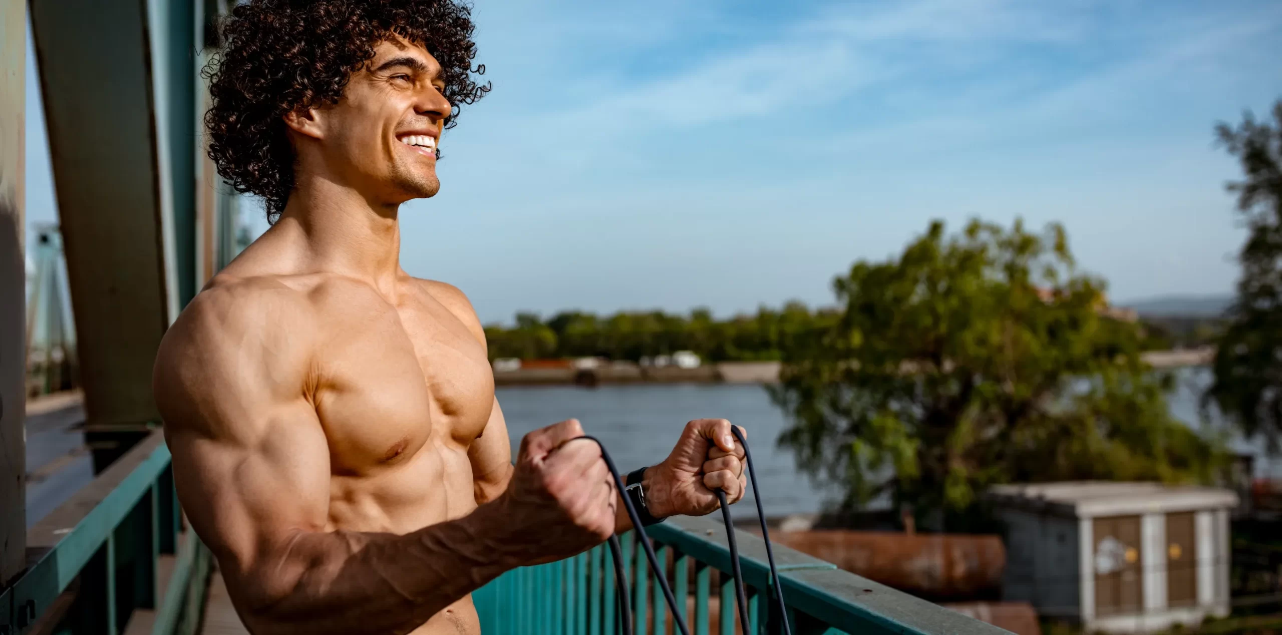 muscular-man-training-on-a-bridge-with-resistance-2026-03-10-04-00-10-utc